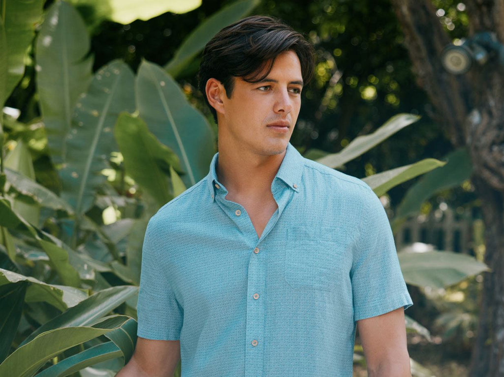 Man wearing blue polo shirt.