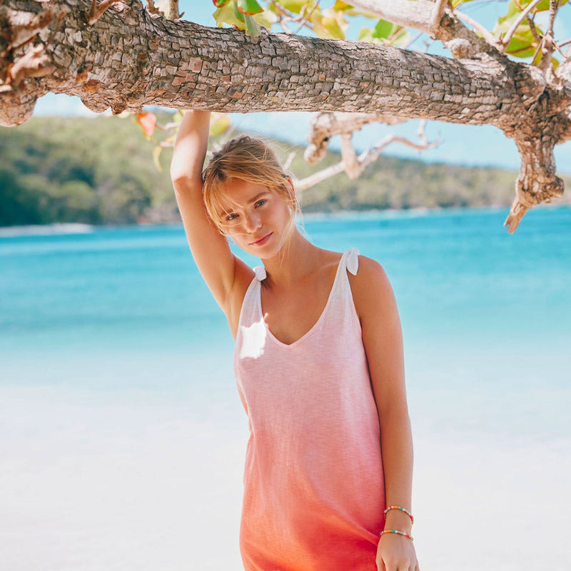 woman standing in front of ocean in sophia sun farer dress