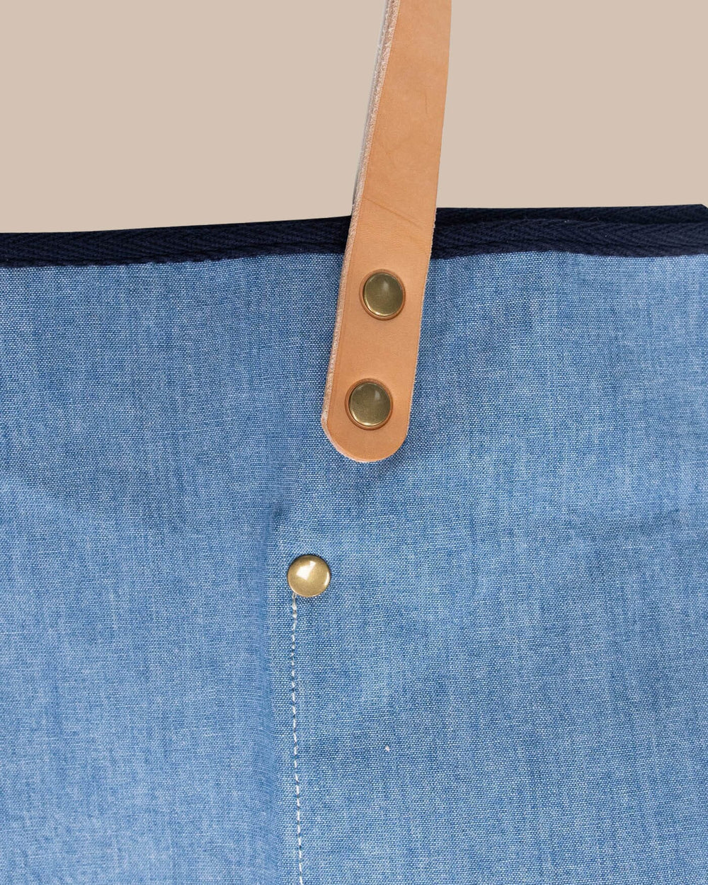 The detail view of the All Day Denim Tote by Southern Tide - Navy