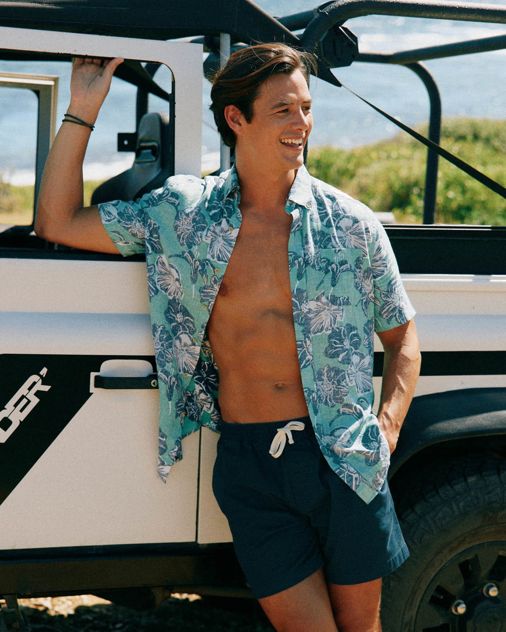The front view of the Southern Tide Beach Blooms Linen Rayon Short Sleeve Sport Shirt by Southern Tide - Lawn Green