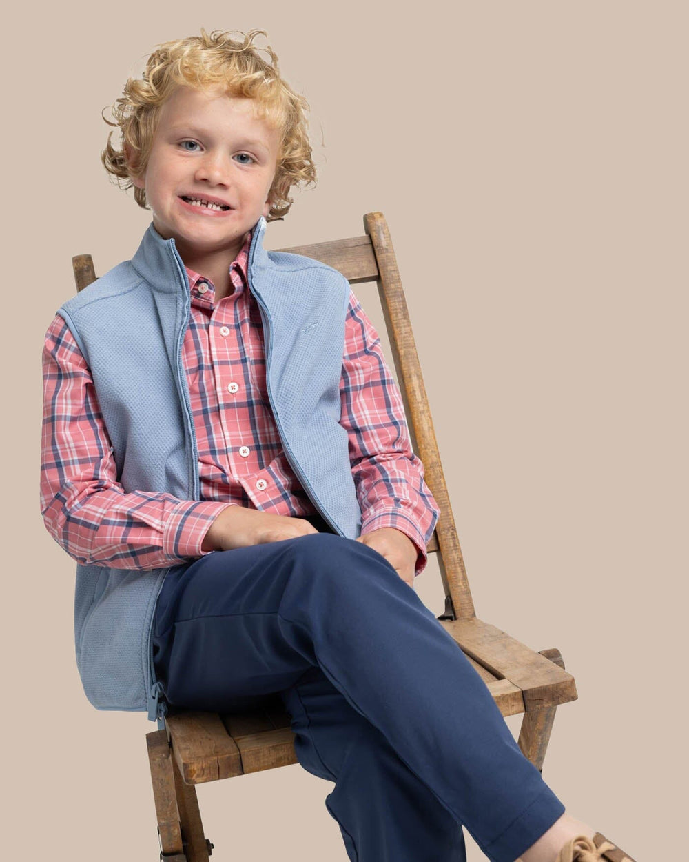 The front view of the Southern Tide Boys Hucksley Vest by Southern Tide - Mountain Spring Blue