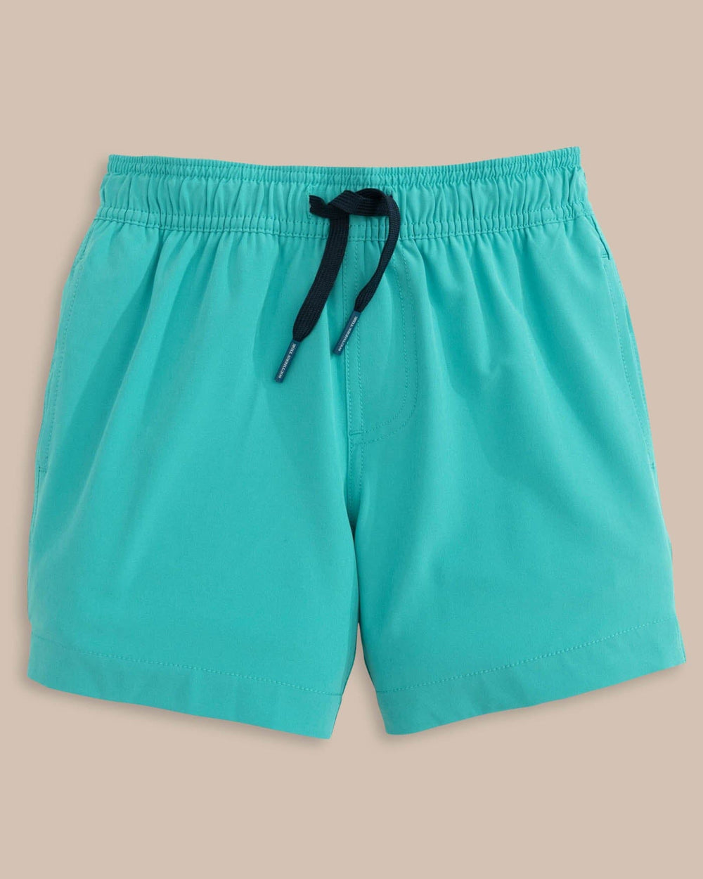The front view of the Southern Tide Boys Solid Swim Truck 2 0 by Southern Tide - Tidal Wave