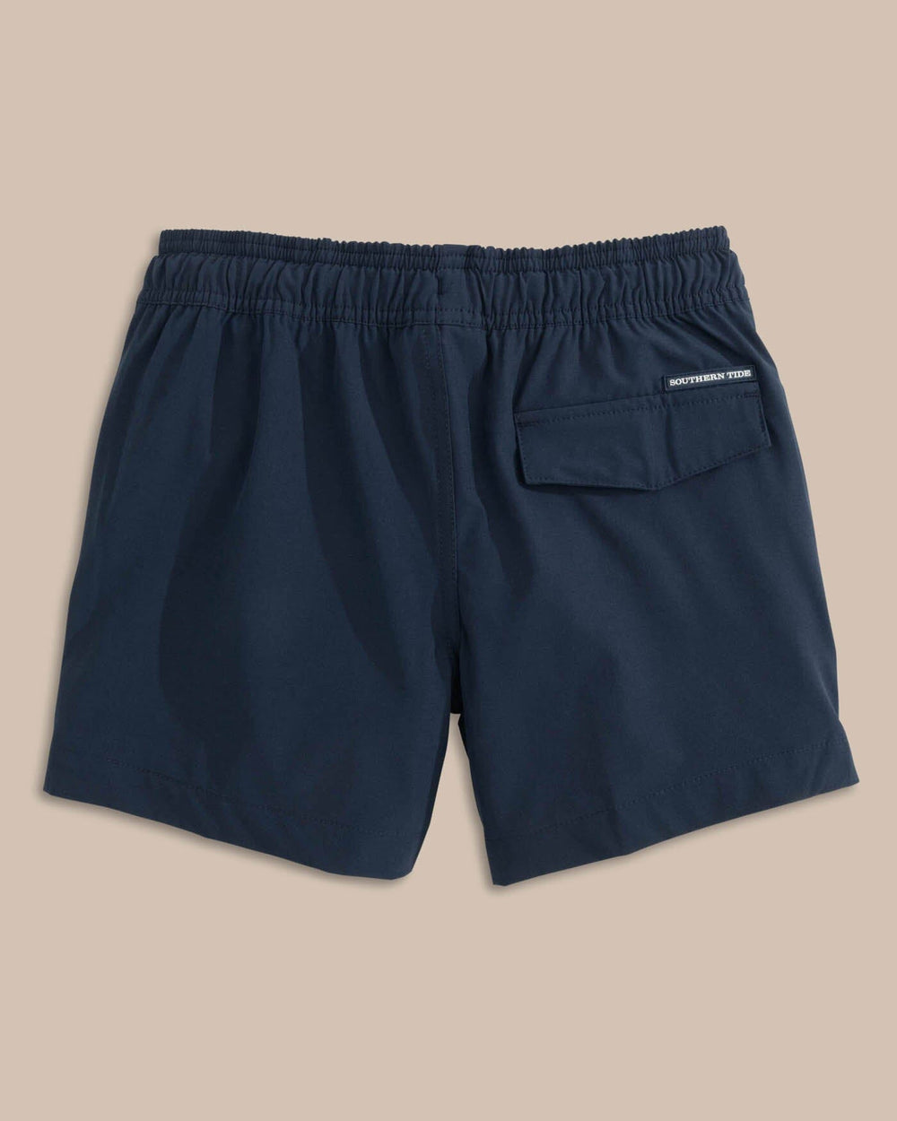 The back view of the Southern Tide Boys Solid Swim Truck 2 0 by Southern Tide - True Navy
