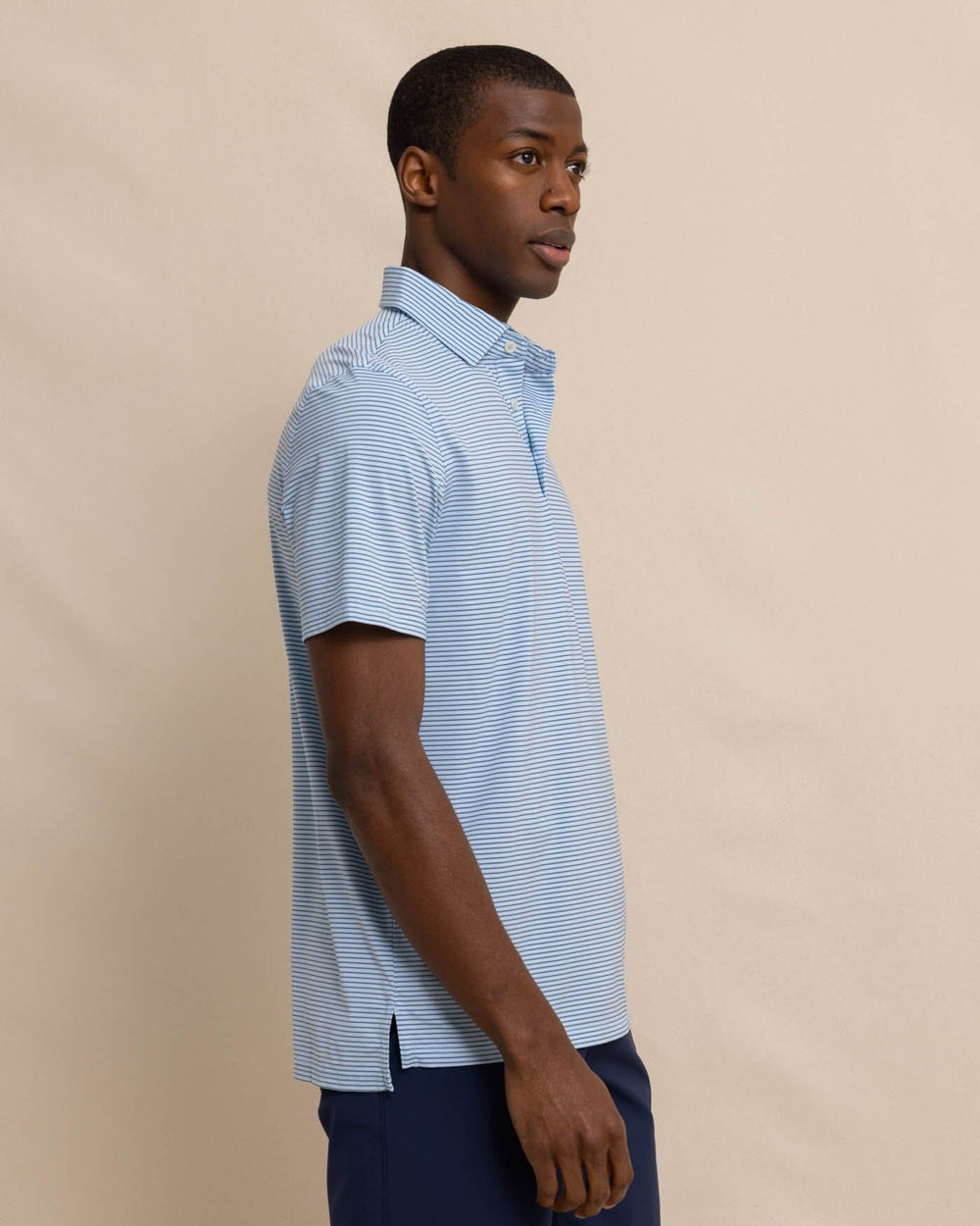 The side view of the Southern Tide brrr-eeze Baytop Stripe Performance Polo by Southern Tide - Clearwater Blue