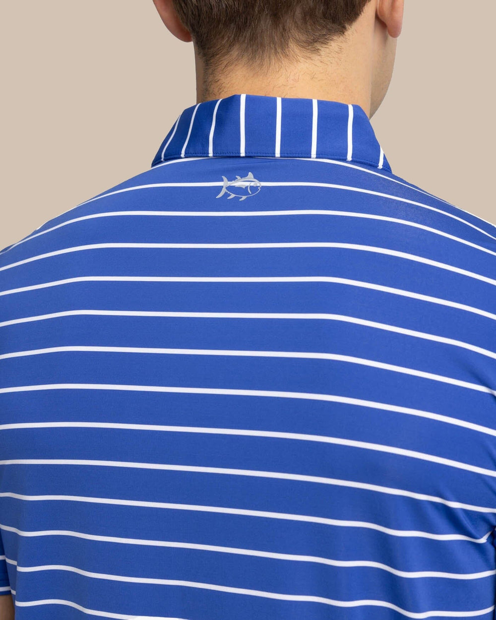 The yoke view of the Southern Tide brrr-eeze Desmond Stripe Performance Polo by Southern Tide - University Blue
