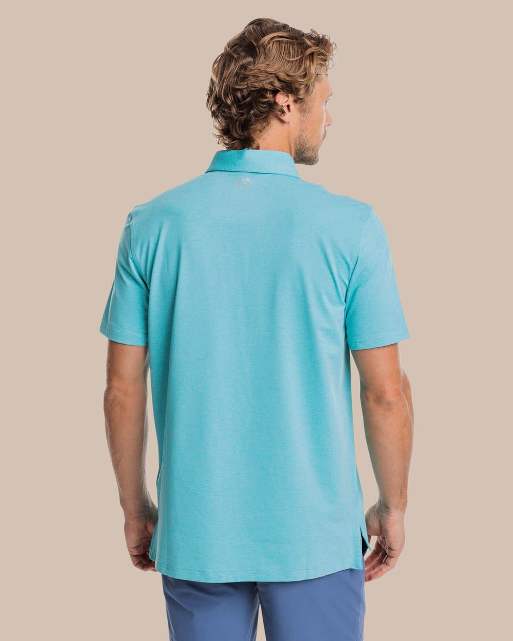 The back view of the brrr°®-eeze Heather Performance Polo Shirt by Southern Tide - Heather Tidal Wave