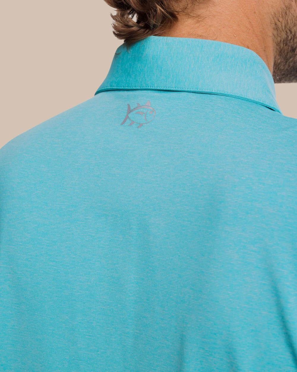 The yoke view of the brrr°®-eeze Heather Performance Polo Shirt by Southern Tide - Heather Tidal Wave