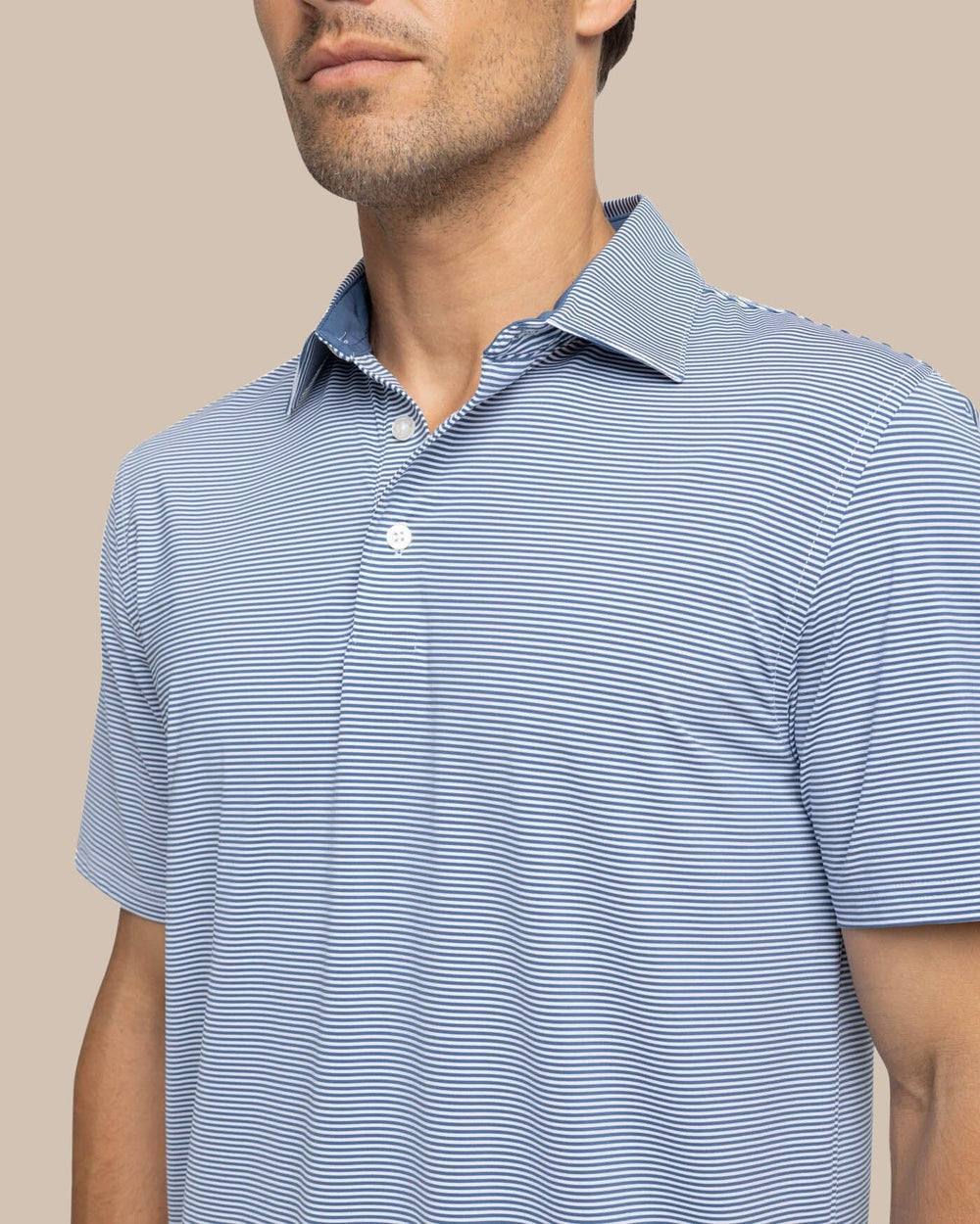 The detail view of the Southern Tide brrr-eeze Meadowbrook Stripe Polo by Southern Tide - Aged Denim