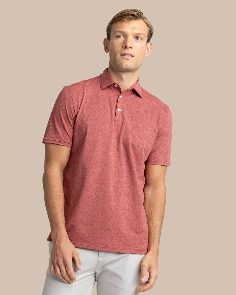 The front view of the Southern Tide brrr-eeze Heather Performance Polo Shirt by Southern Tide - Heather Tuscany Red