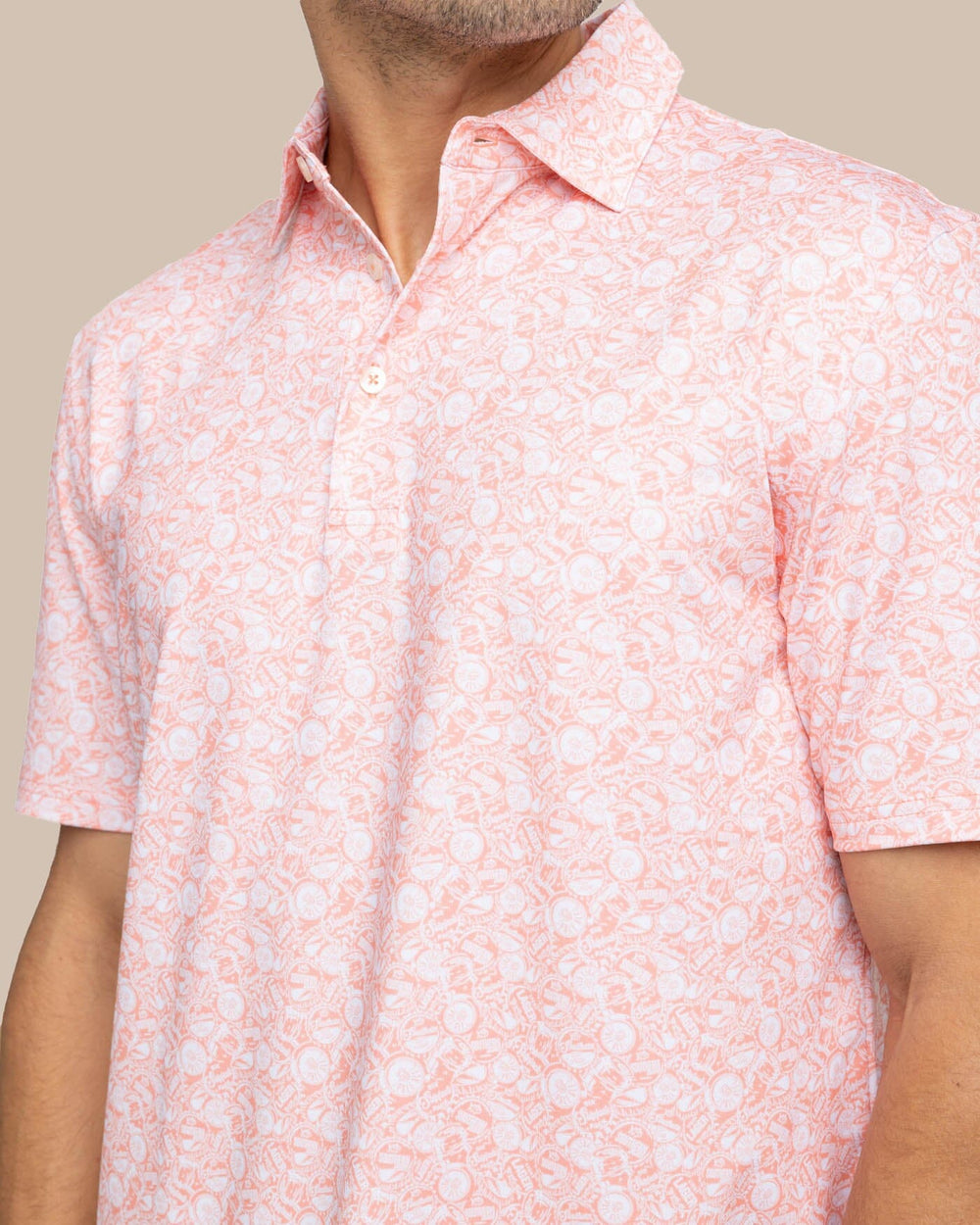 The detail view of the Southern Tide Driver Caps Off Printed Polo by Southern Tide - Desert Flower Coral