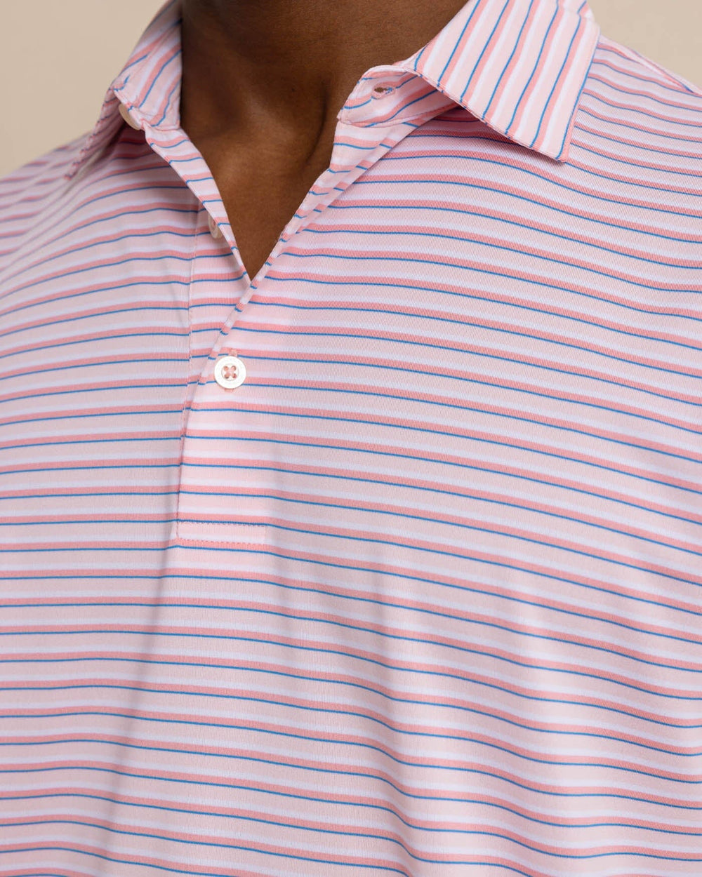 The detail view of the Southern Tide Driver Carova Stripe Polo Shirt by Southern Tide - Light Pink