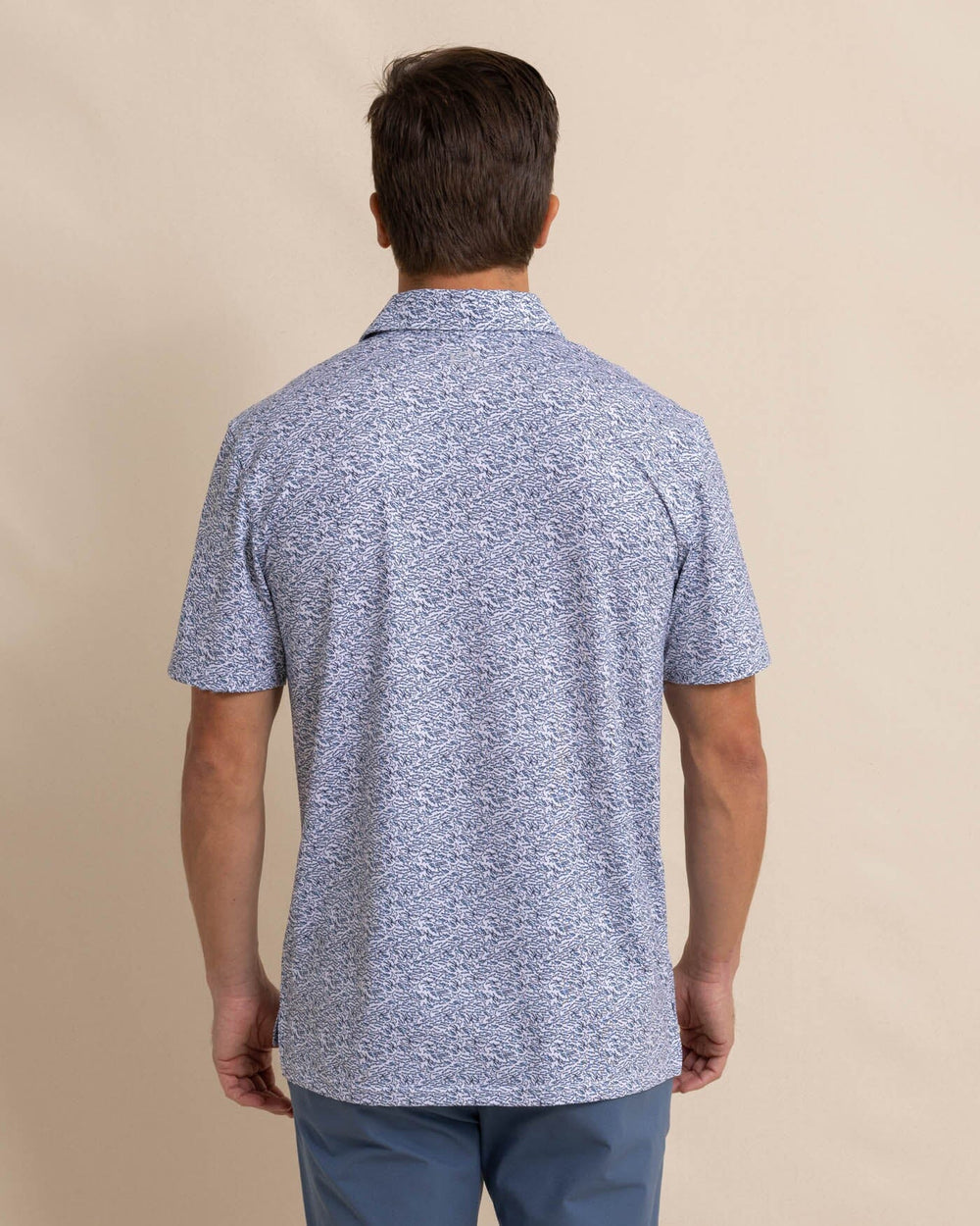 The back view of the Southern Tide Driver Schooling Fish Polo Shirt by Southern Tide - Classic White