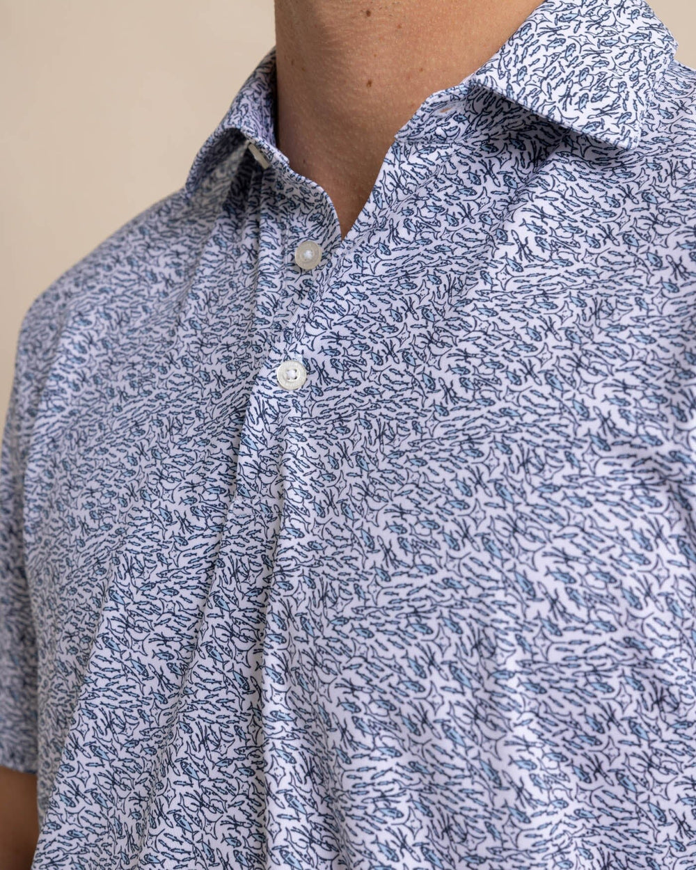 The detail view of the Southern Tide Driver Schooling Fish Polo Shirt by Southern Tide - Classic White