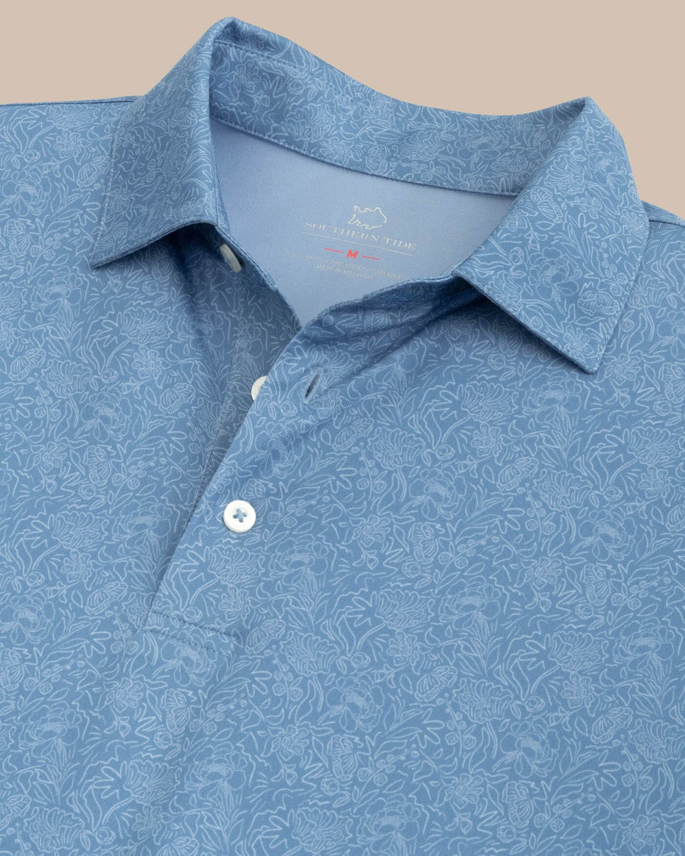 The detail view of the Southern Tide Driver Sunny Blooms Polo Shirt by Southern Tide - Coronet Blue