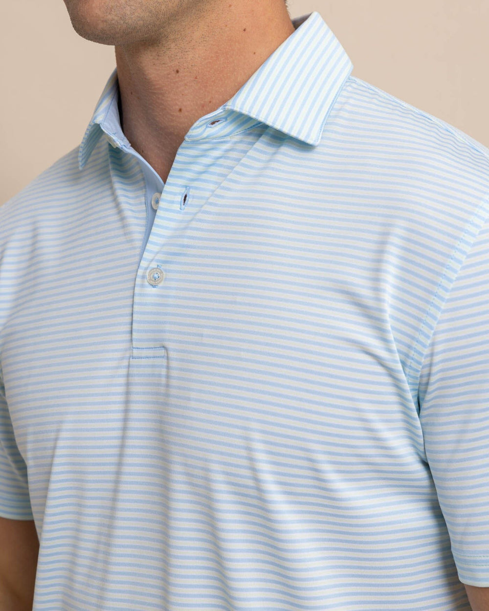 The detail view of the Southern Tide Driver Verdae Stripe Polo by Southern Tide - Seacrest Green