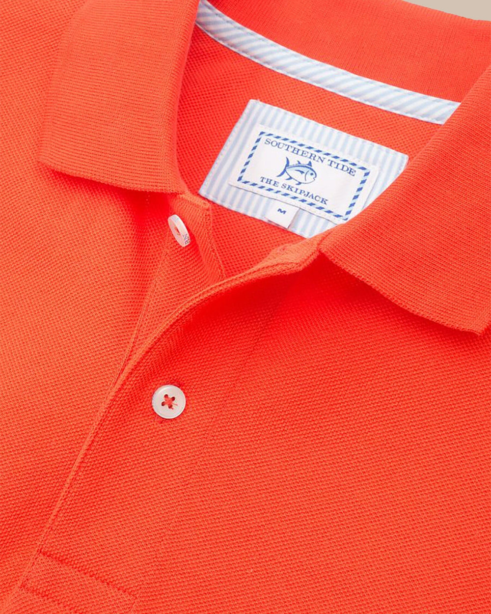 The detail of the Men's Light Blue Florida Gators Pique Polo Shirt by Southern Tide - Endzone Orange