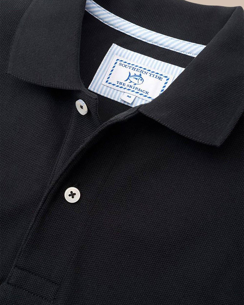 The detail of the Men's Black Alabama Crimson Tide Pique Polo Shirt by Southern Tide - Black