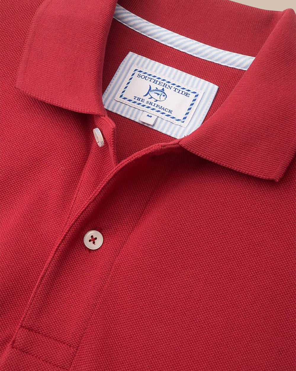 The detail of the Men's Red Alabama Crimson Tide Pique Polo Shirt by Southern Tide - Crimson