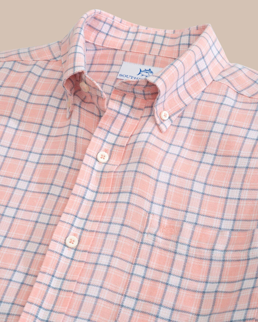 The front view of the Headland Conestee Plaid Long Sleeve Sport Shirt by Southern Tide - Apricot Blush Coral