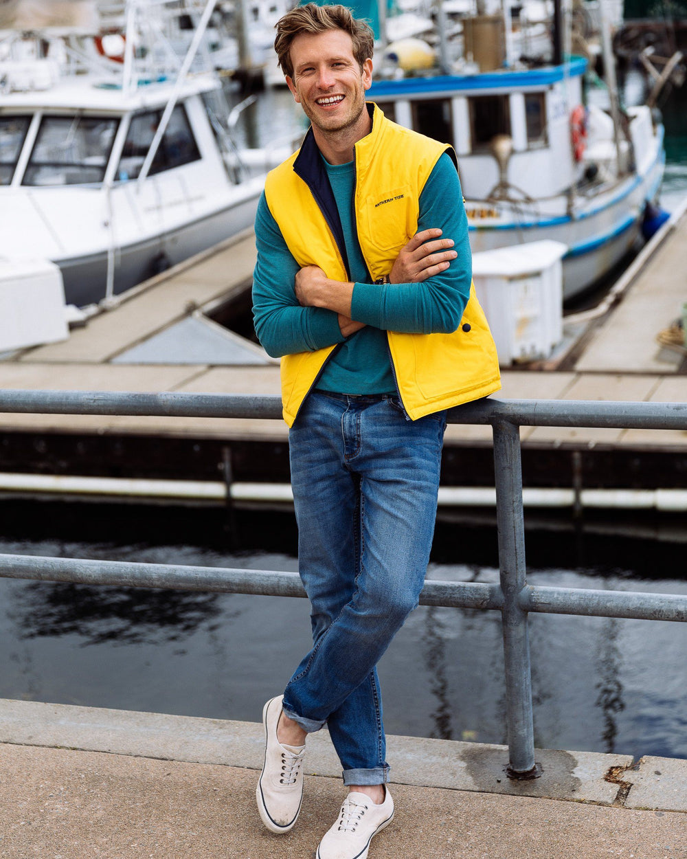 The lifestyle view of the Men's Navy Charleston Denim Jeans by Southern Tide - True Navy