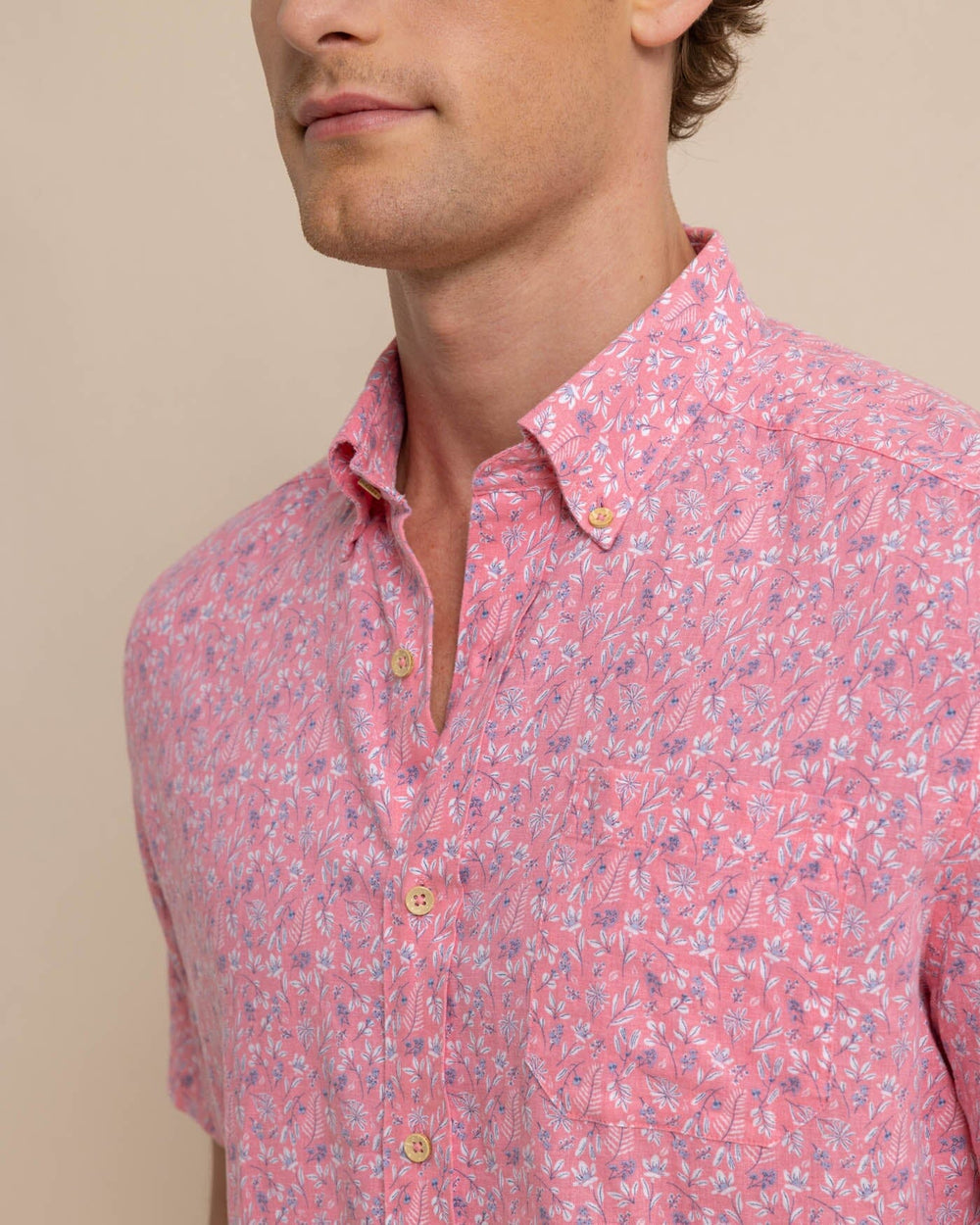 The detail view of the Southern Tide Linen Rayon Ditzy Floral Short Sleeve Sport Shirt by Southern Tide - Geranium Pink