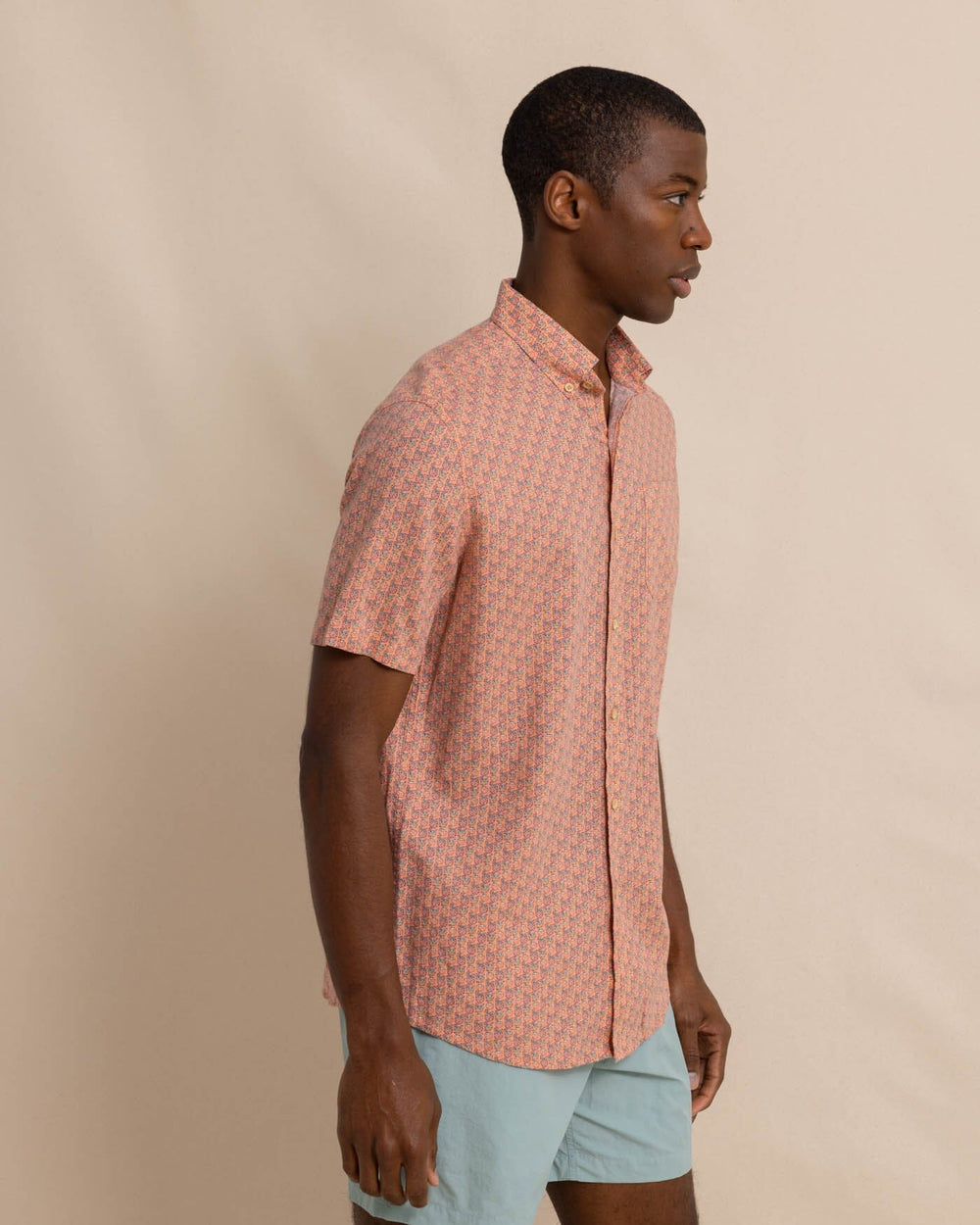 The front view of the Southern Tide Linen Rayon Vacation Views Short Sleeve SportShirt by Southern Tide - Desert Flower Coral