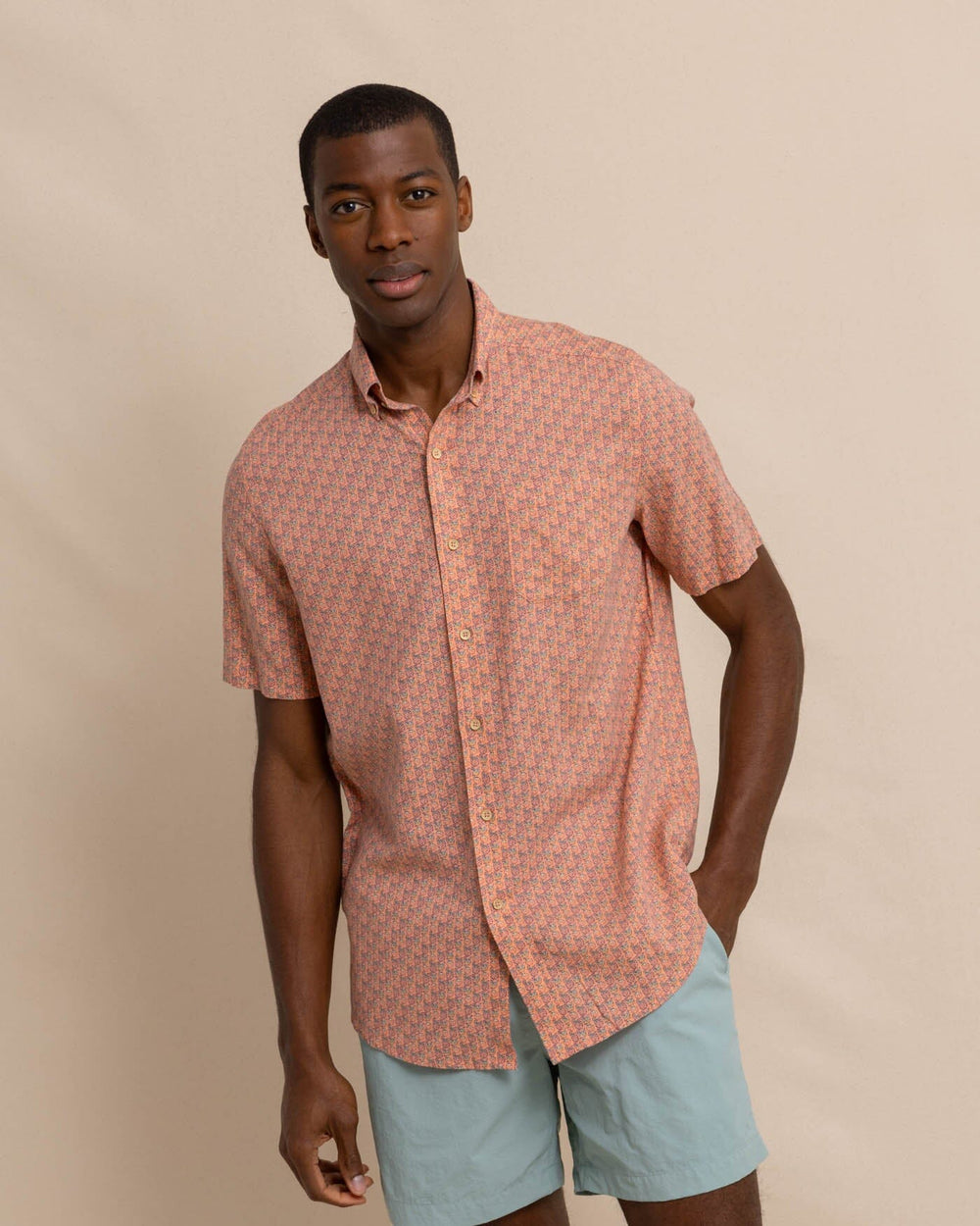 The front view of the Southern Tide Linen Rayon Vacation Views Short Sleeve SportShirt by Southern Tide - Desert Flower Coral