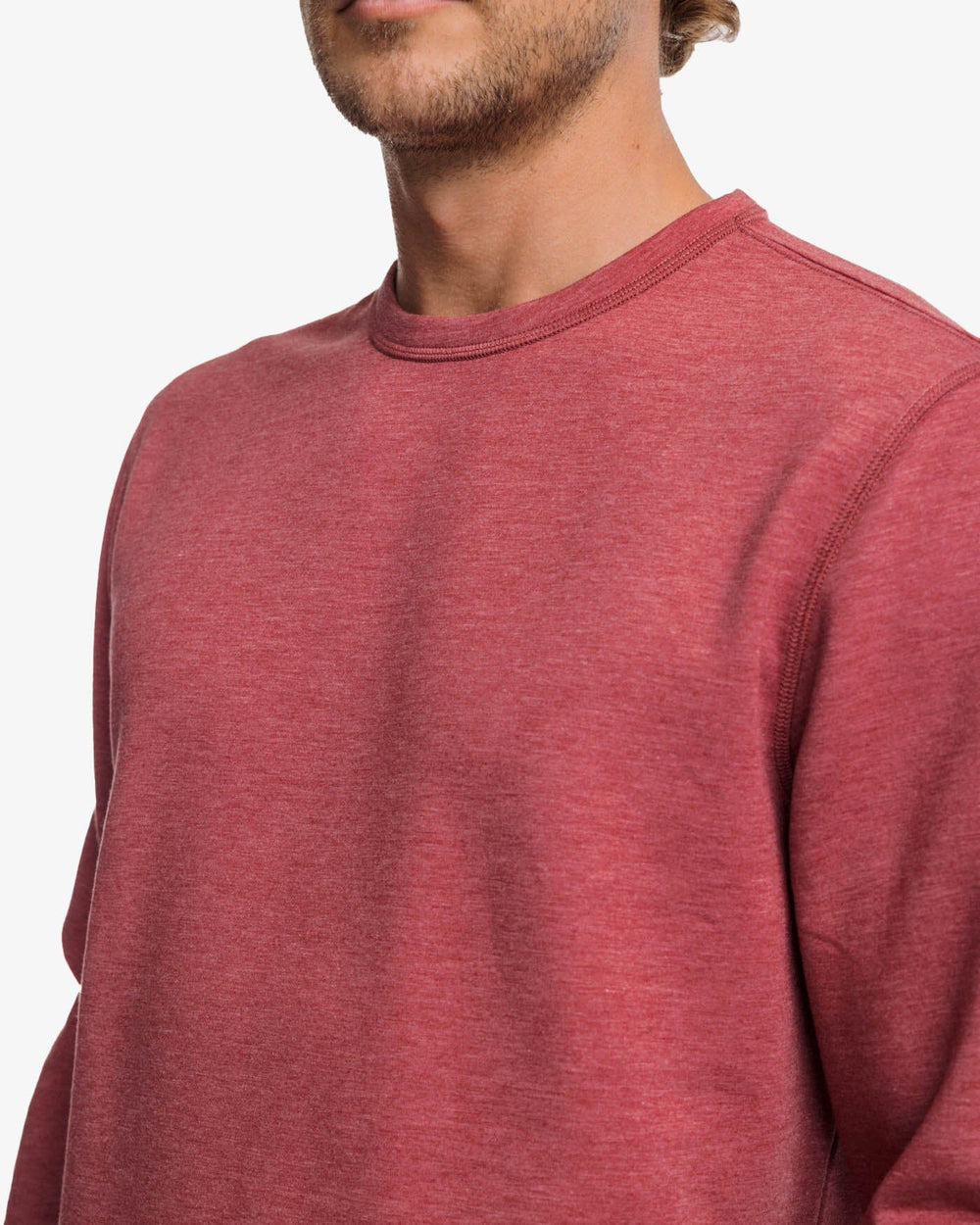 The detail view of the Southern Tide Lockley Heather Interlock Crew by Southern Tide - Heather Tuscany Red