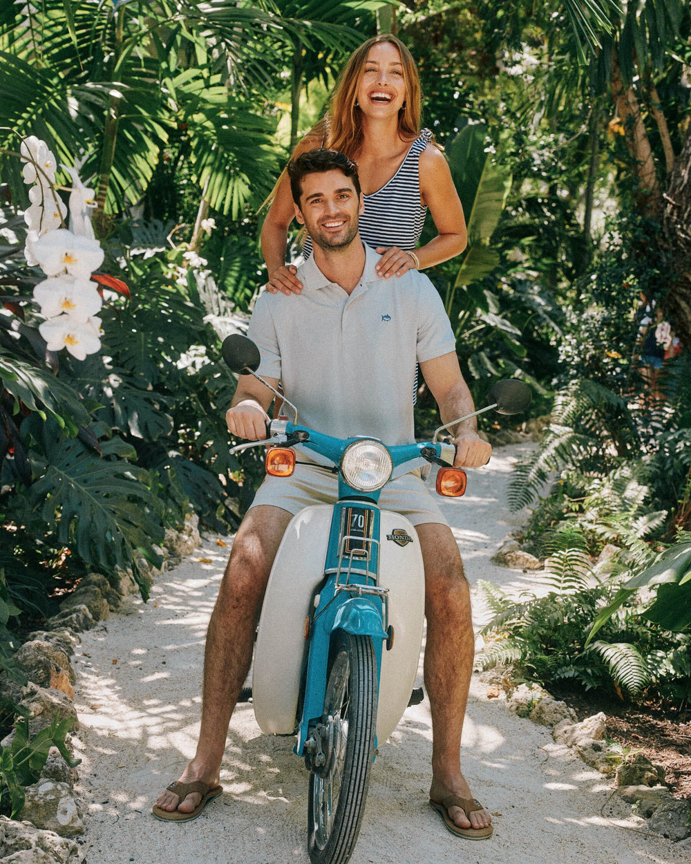 The lifestyle front view of the Men's New Skipjack Polo Shirt by Southern Tide - Slate Grey