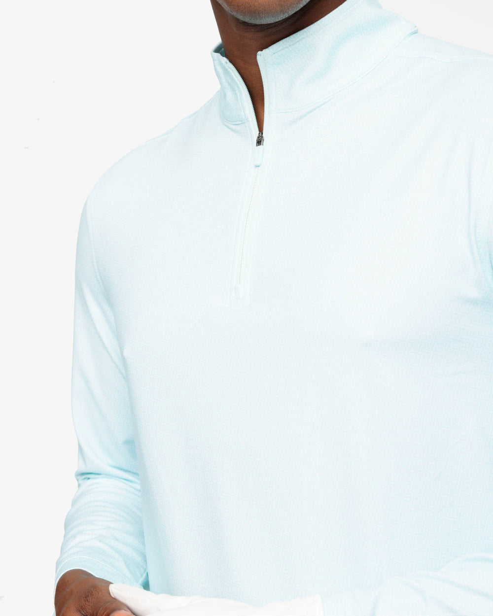 The detail view of the Southern Tide Pine Ridge Print Cruiser Quarter Zip Pullover by Southern Tide - Baltic Teal