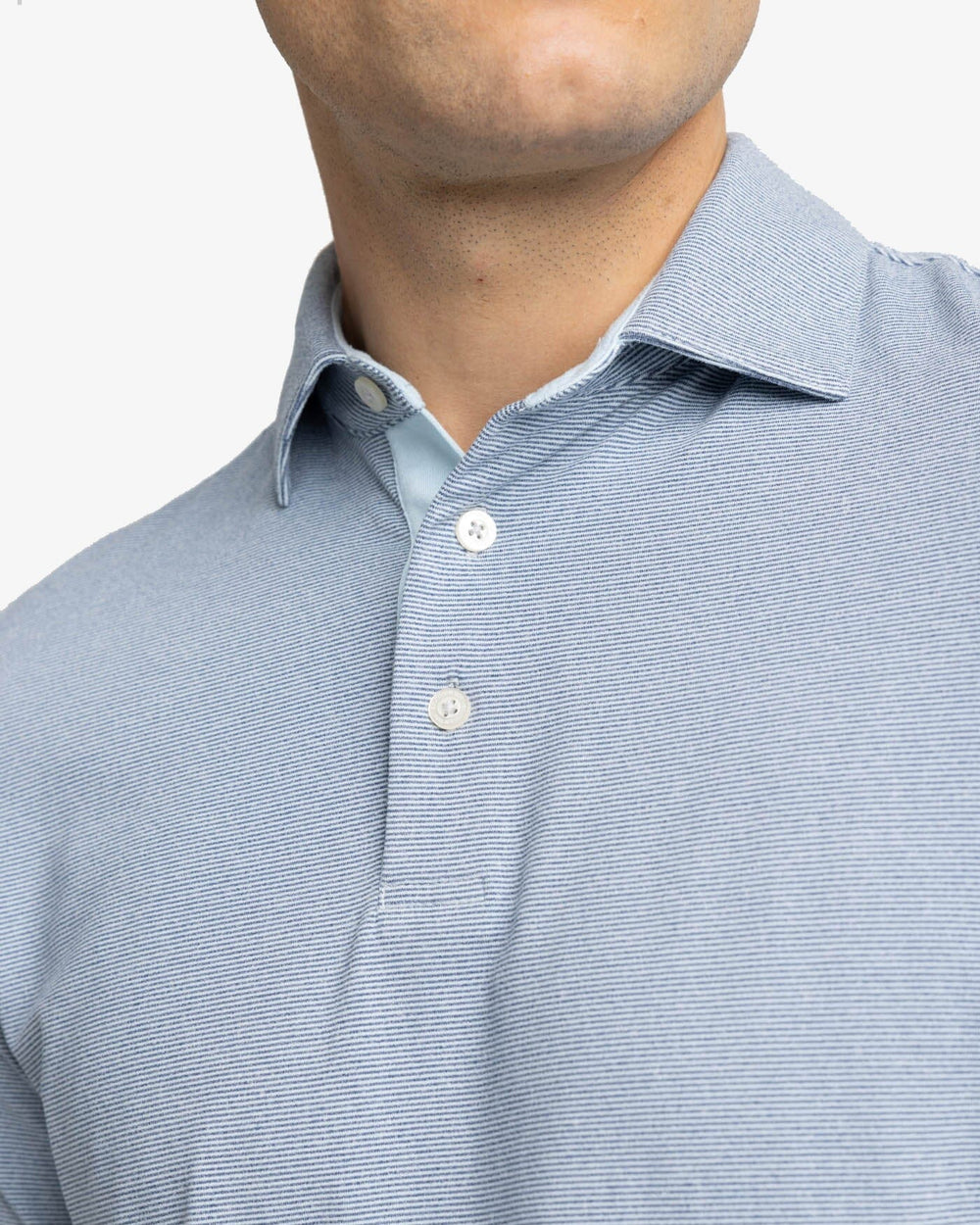 The detail view of the Southern Tide Ryder Heather Ridgeway Stripe Long Sleeve Performance Polo by Southern Tide - Heather Dress Blue