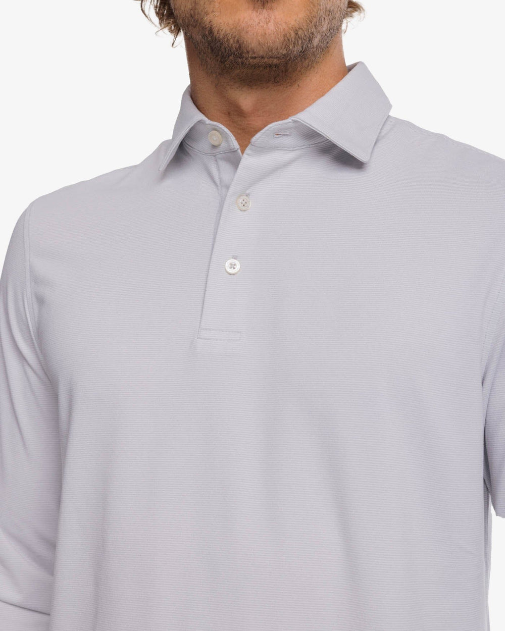 The detail view of the Southern Tide Ryder Heather Ridgeway Stripe Long Sleeve Performance Polo by Southern Tide - Heather Platinum Grey