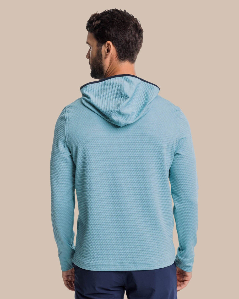 The back view of the Southern Tide Scuttle Heather Performance Quarter Zip Hoodie by Southern Tide - Heather Ocean Teal