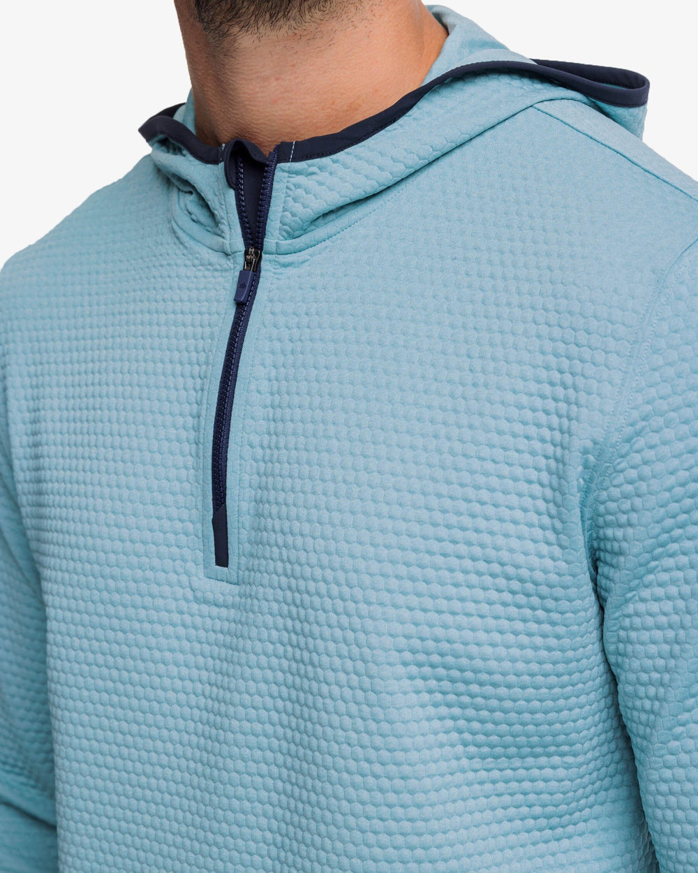 The detail view of the Southern Tide Scuttle Heather Performance Quarter Zip Hoodie by Southern Tide - Heather Ocean Teal