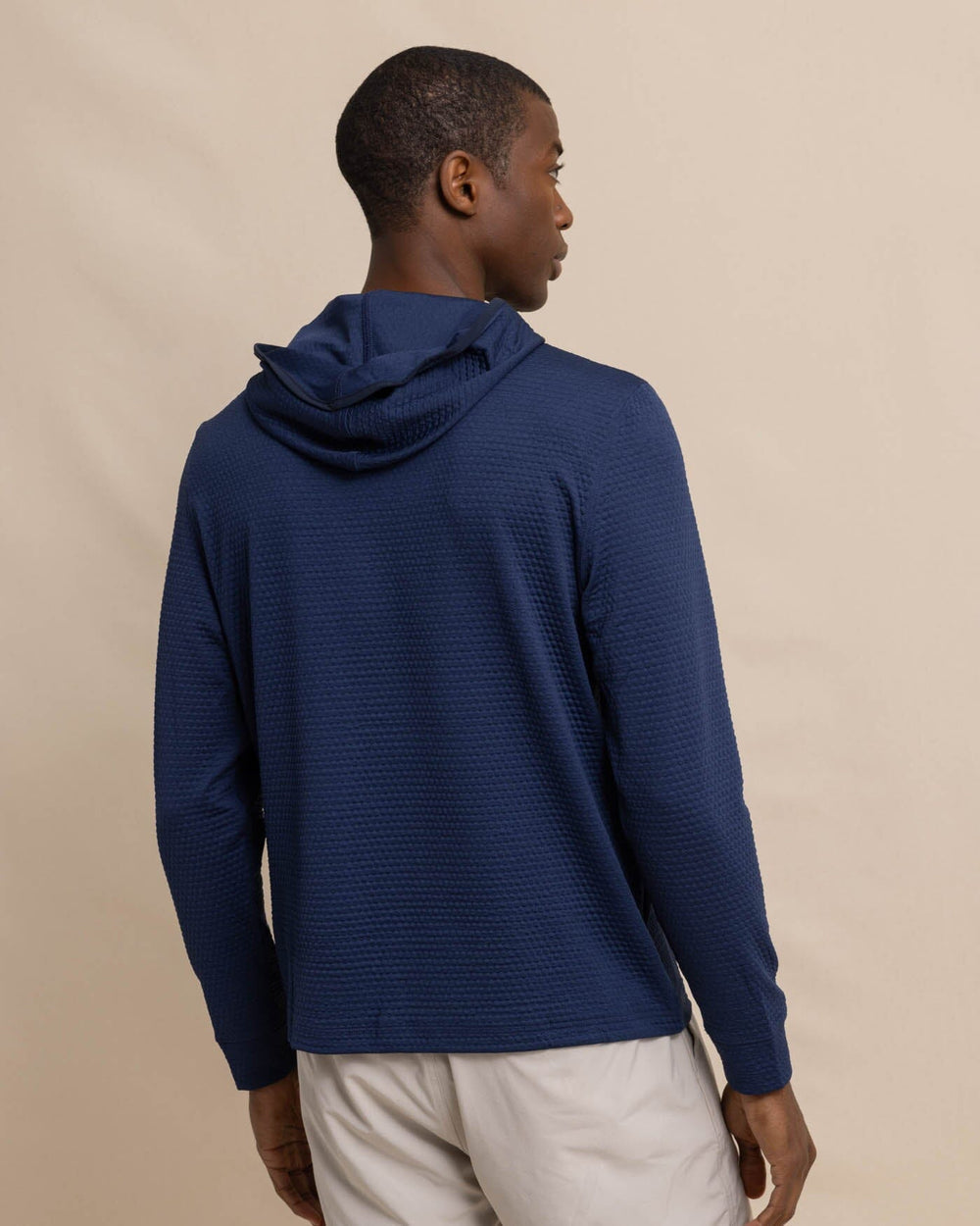 The back view of the Southern Tide Scuttle Heather Performance Quarter Zip Hoodie by Southern Tide - Heather True Navy