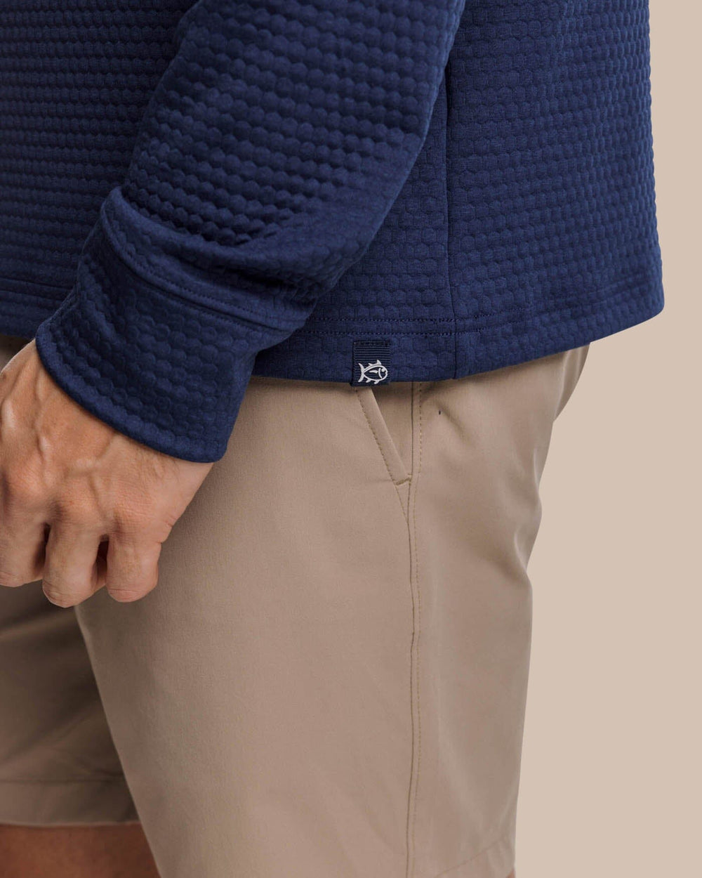 The detail view of the Southern Tide Scuttle Heather Performance Quarter Zip Hoodie by Southern Tide - Heather True Navy
