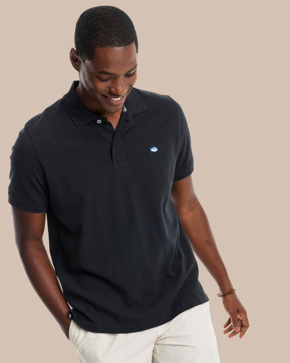 The model front view of the Men's New Skipjack Polo Shirt by Southern Tide - Midnight Black