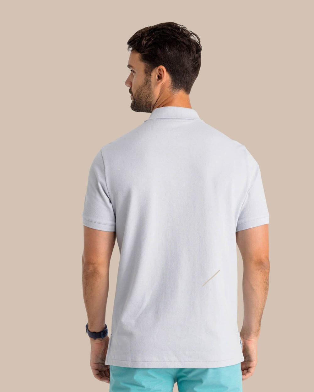The model back view of the Men's New Skipjack Polo Shirt by Southern Tide - Slate Grey