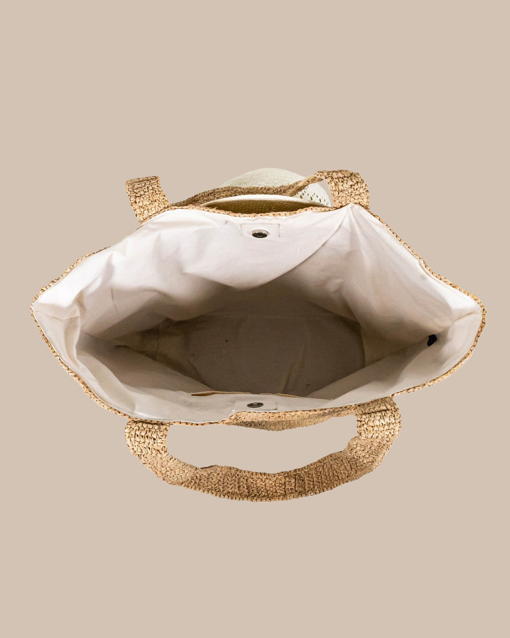 The detail view of the Southern Tide Straw Hat Carrier Beach Tote by Southern Tide - Natural