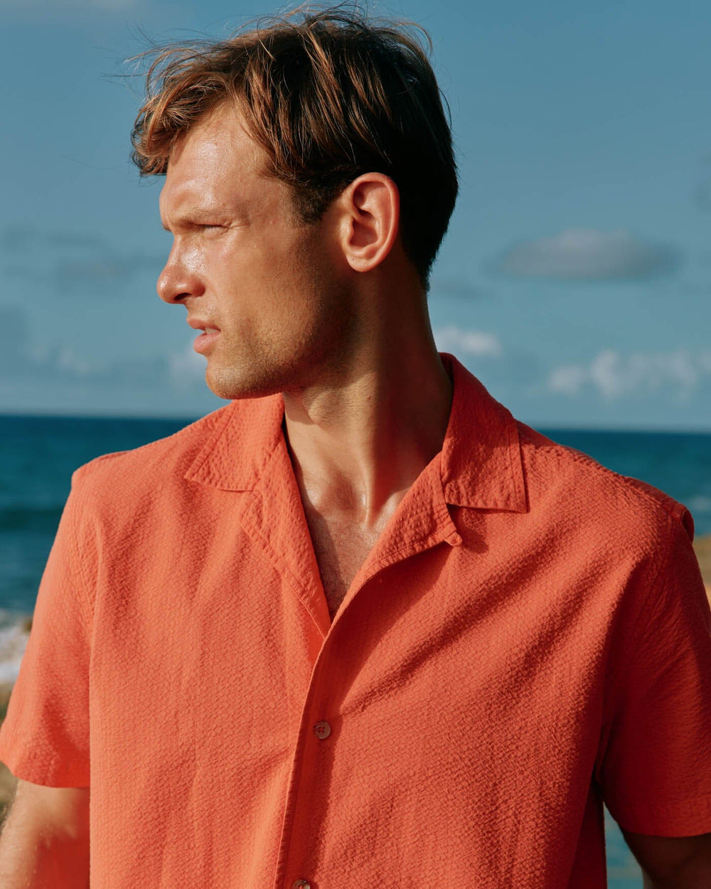 The front view of the Southern Tide Sun Washed Seerscuker Camp Short Sleeve Sport Shirt by Southern Tide - Paprika Red