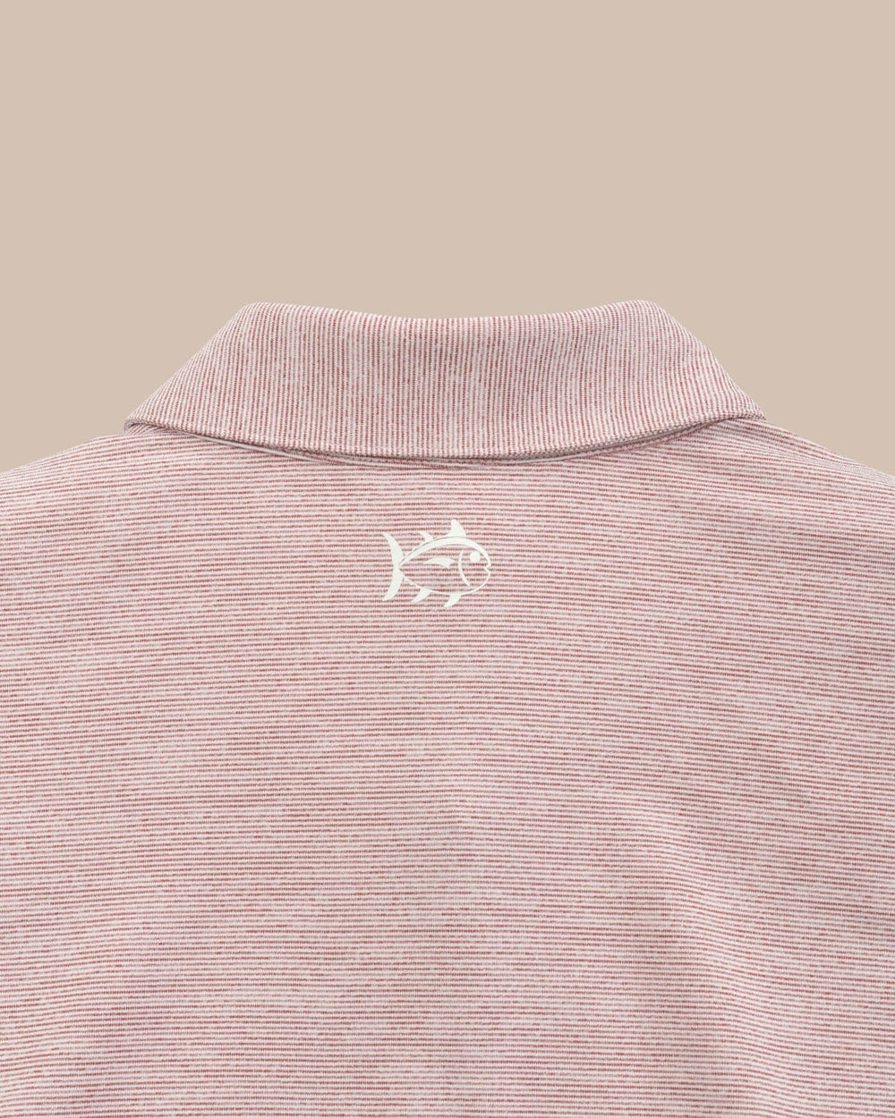 The yoke of the Alabama Crimson Tide Driver Spacedye Polo Shirt by Southern Tide - Crimson