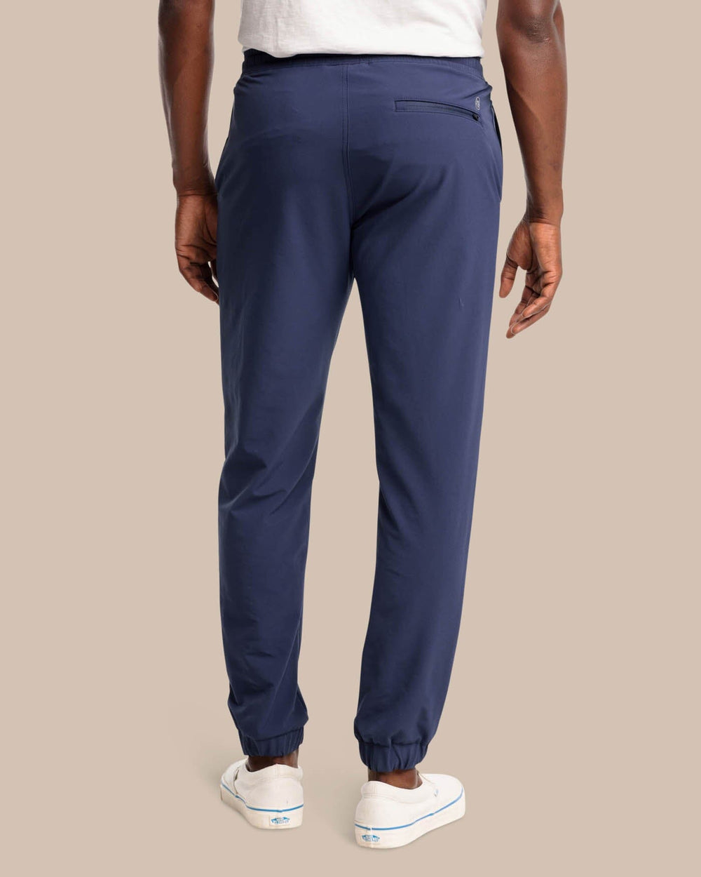 The back view of the The Excursion Performance Jogger by Southern Tide - True Navy