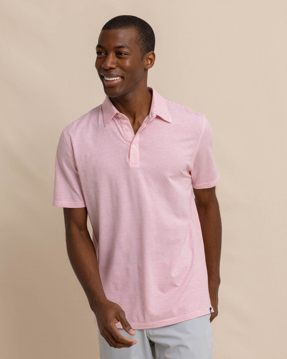 The front view of the Southern Tide The Seaport Davenport Stripe Polo by Southern Tide - Teaberry Pink