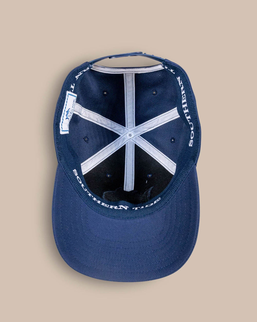 The detail view of the Southern Tide Youth Rockets Red Glare Performance Hat by Southern Tide - Navy